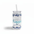 Mati Made clear glass can-shaped tumbler with blue evil eye motif, lid, and reusable straw for iced drinks.