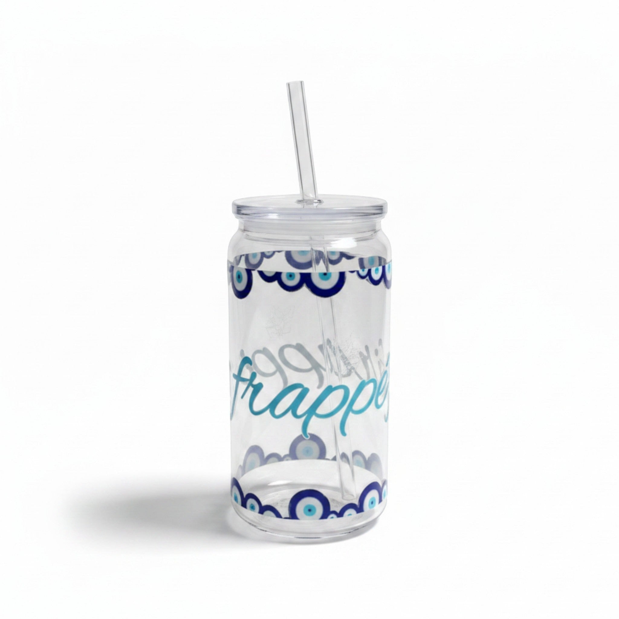 Mati Made clear glass can-shaped tumbler with blue evil eye motif, lid, and reusable straw for iced drinks.
