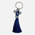 Mati Made light blue leather cross keychain with a teardrop evil eye charm and a vibrant deep blue silk tassel.