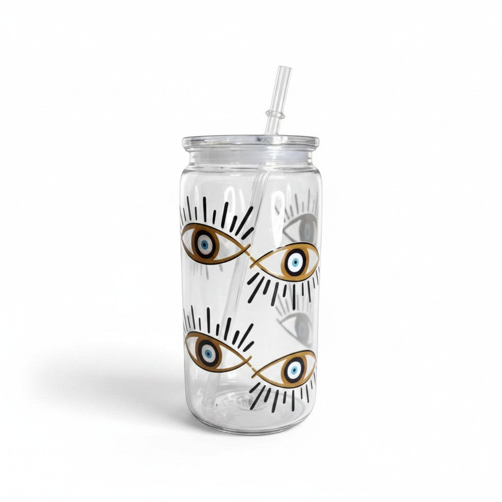 Mati Made clear plastic can-style tumbler with a blue evil eye pattern, lid, and reusable straw.