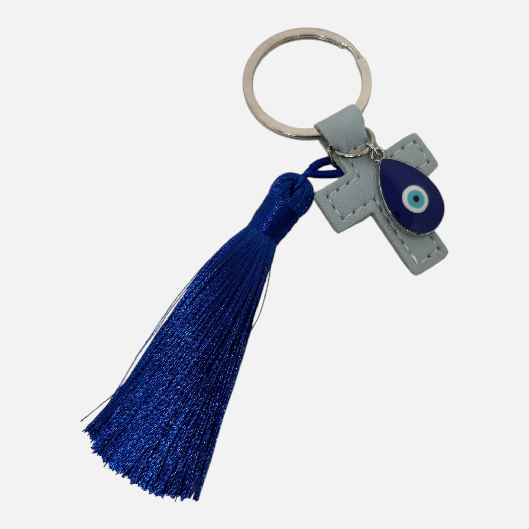 Mati Made light blue leather-look cross keychain featuring a teardrop evil eye charm and a vibrant deep blue tassel.
