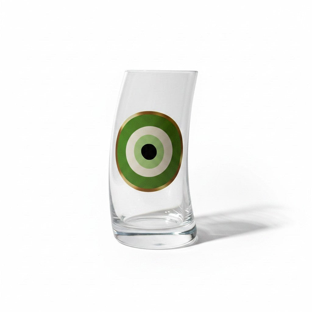 Mati Made curved glass tumbler featuring a green, black, and gold circular graphic decal on clear crystal glass.