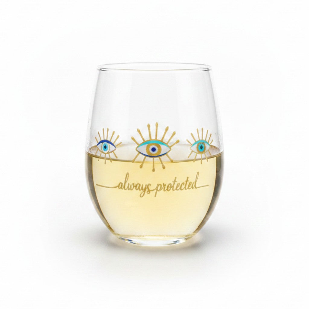 Mati Made stemless wine glass with blue and gold evil eye motif and always protected script text on clear glass.