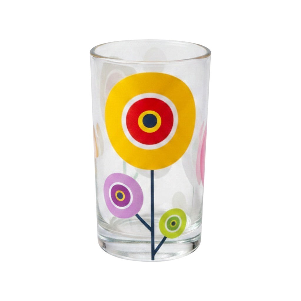 Mati Made clear glass tumbler featuring colorful whimsical floral circular patterns in yellow, pink, and green.