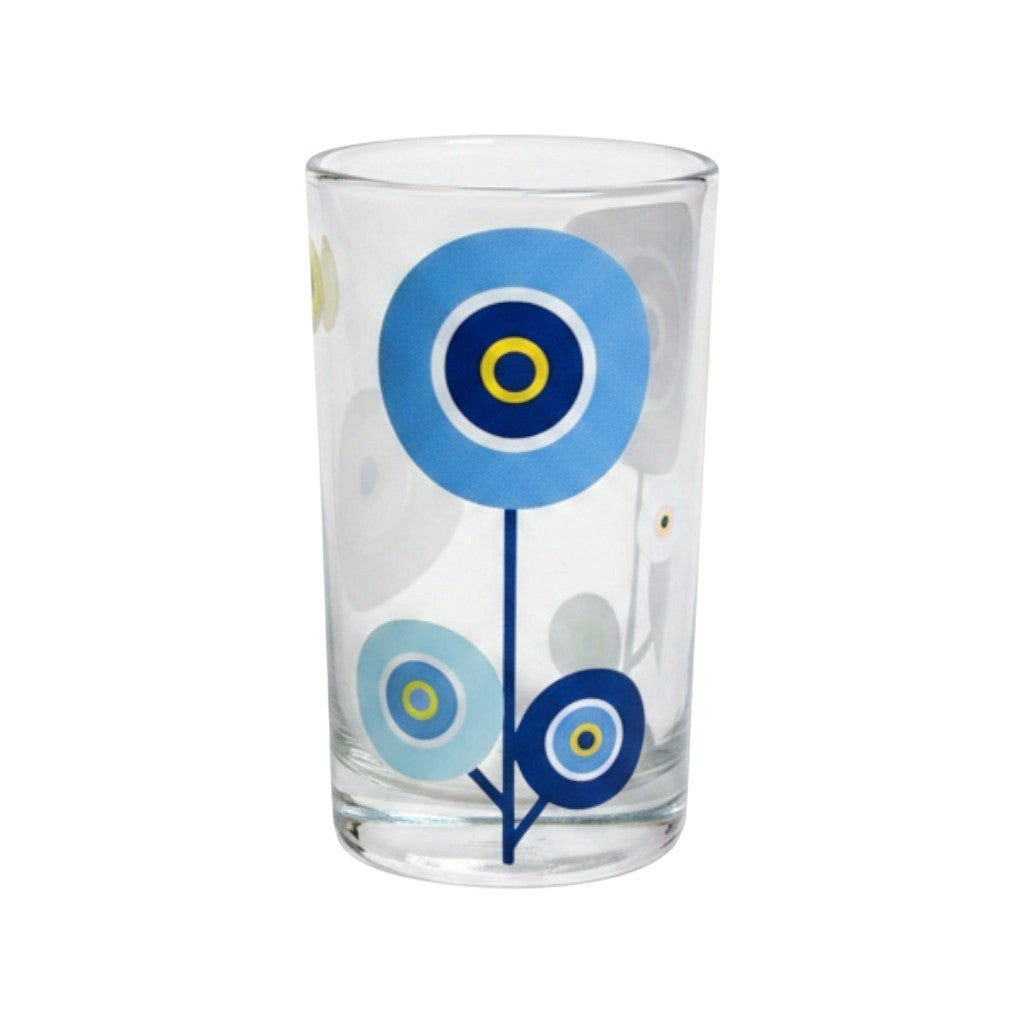 Mati Made clear glass tumbler featuring a whimsical blue circular floral motif on a sleek cylindrical silhouette.