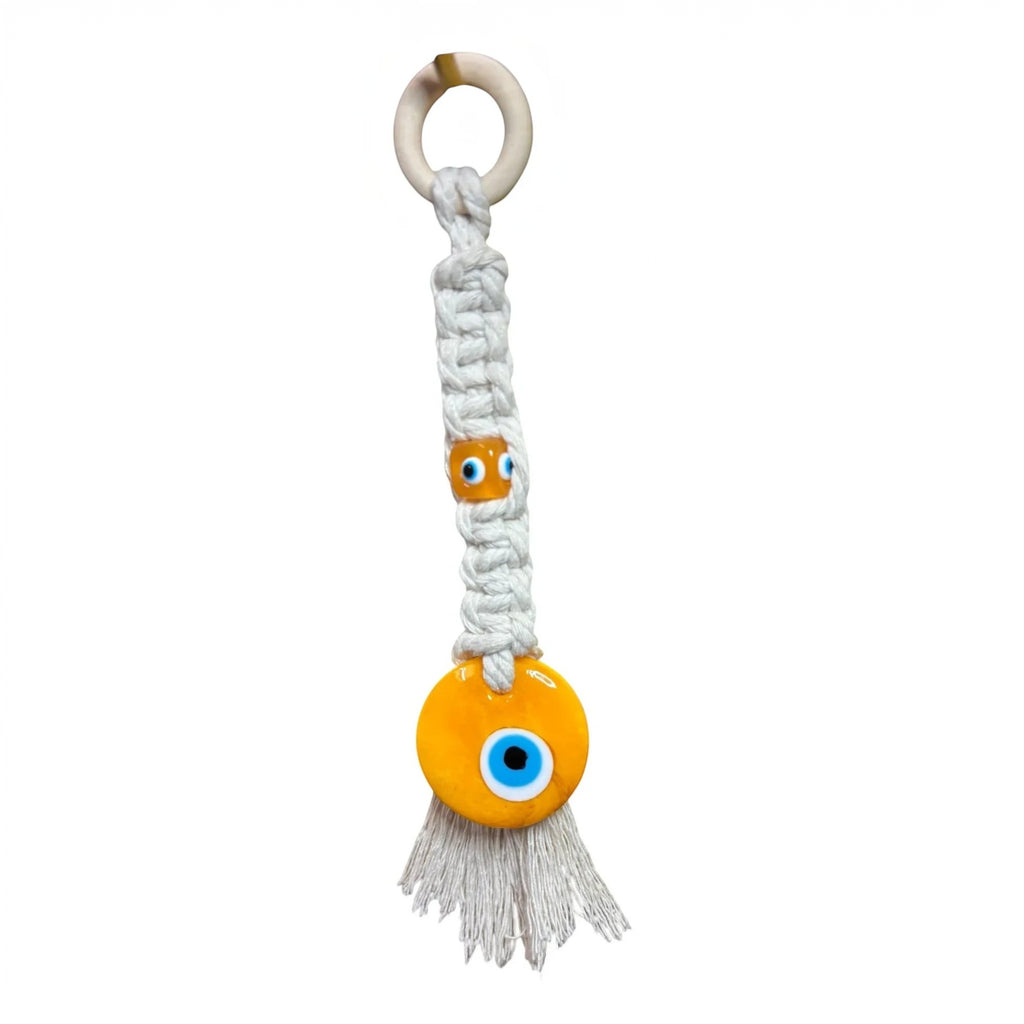 Mati Made white cotton macrame wall hanging with yellow glass evil eye beads and a natural wooden ring