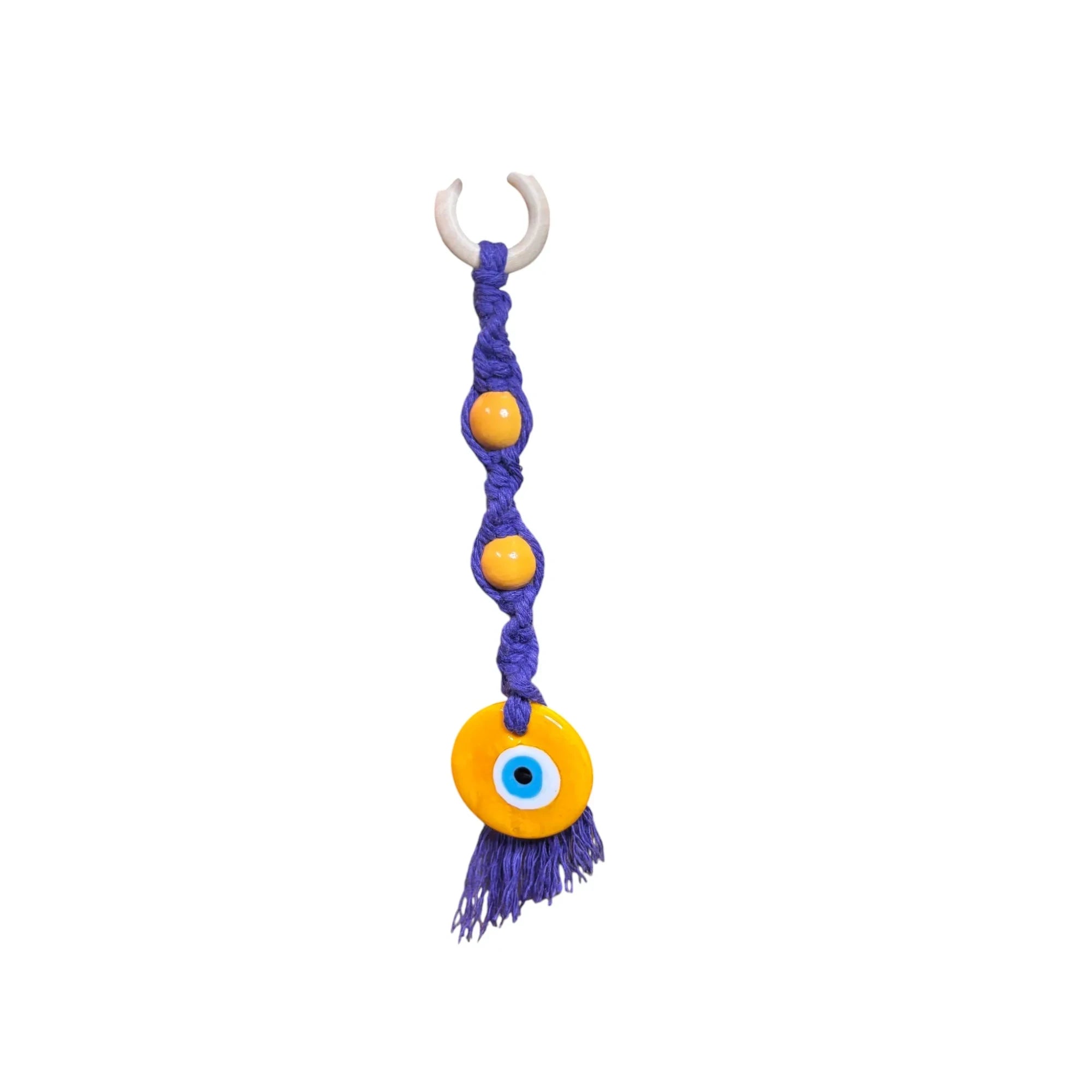 Mati Made handcrafted purple macrame wall hanging with yellow wooden beads and a protective evil eye glass charm
