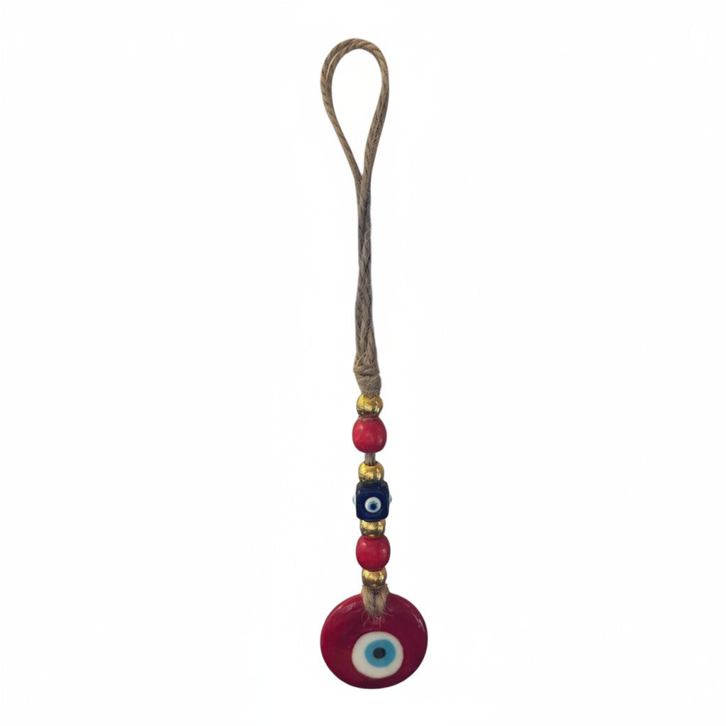 Mati Made decorative red glass evil eye wall hanging with blue and red beads and gold-tone spacers on a jute cord.